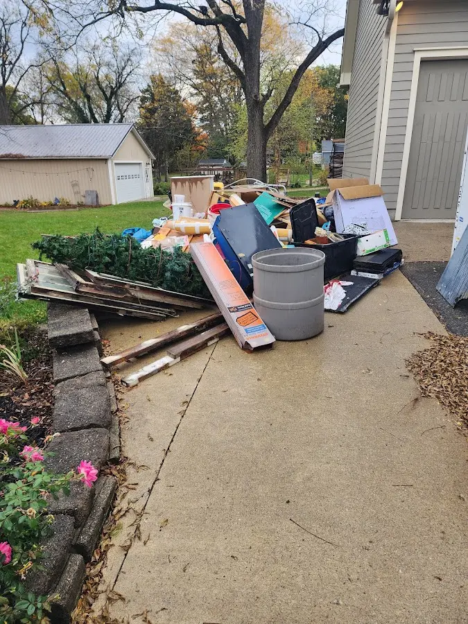 Dumpster being loaded with debris for Roofing Dumpster Rental in Concord